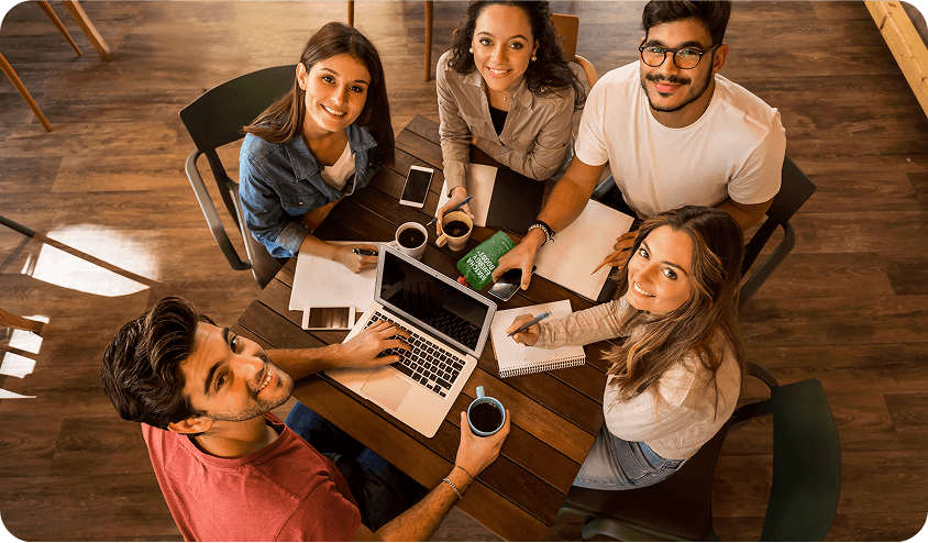 Snacking at work young employees around the table with Nutrino Lab Matcha Energy Boost
