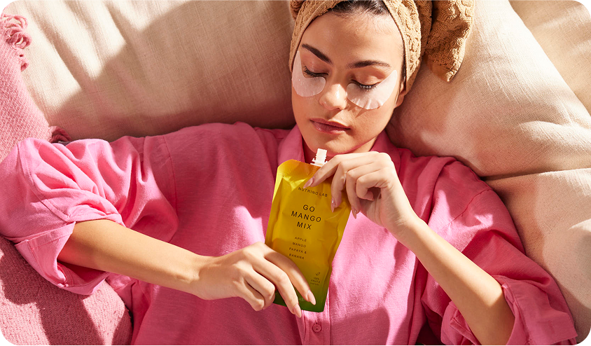 Snacking rituals simple habits significant benefits woman doing skincare relaxing enjoying holding Nutrinio Lab Go Mango