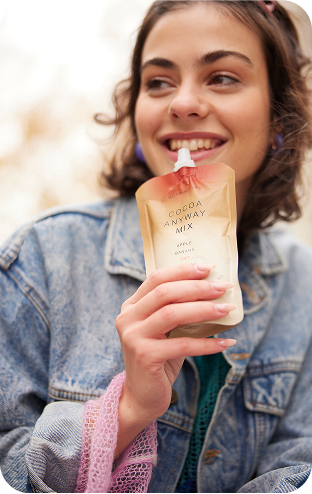 Snacking rituals snacking at university young girl woman smiling enjoying holding Nutrino Lab Cocoa Anyway