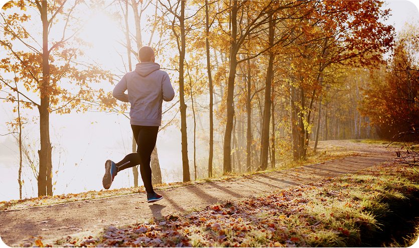 Start of the day Why is morning exercise important for the body man running in the forest doing sports