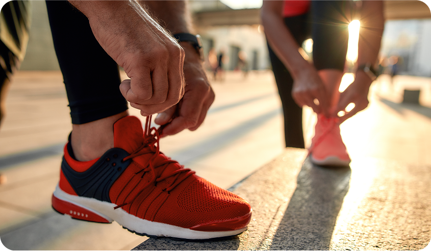 Walks and marathons a journey of strength discipline and self discovery two people tying shoes doing sports running