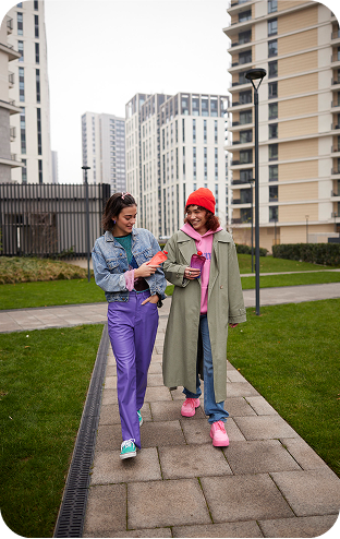 Walks and marathons walking together when movement builds connection two girls women walking smiling holding Nutrino Lab Very Berry Mix and Berry